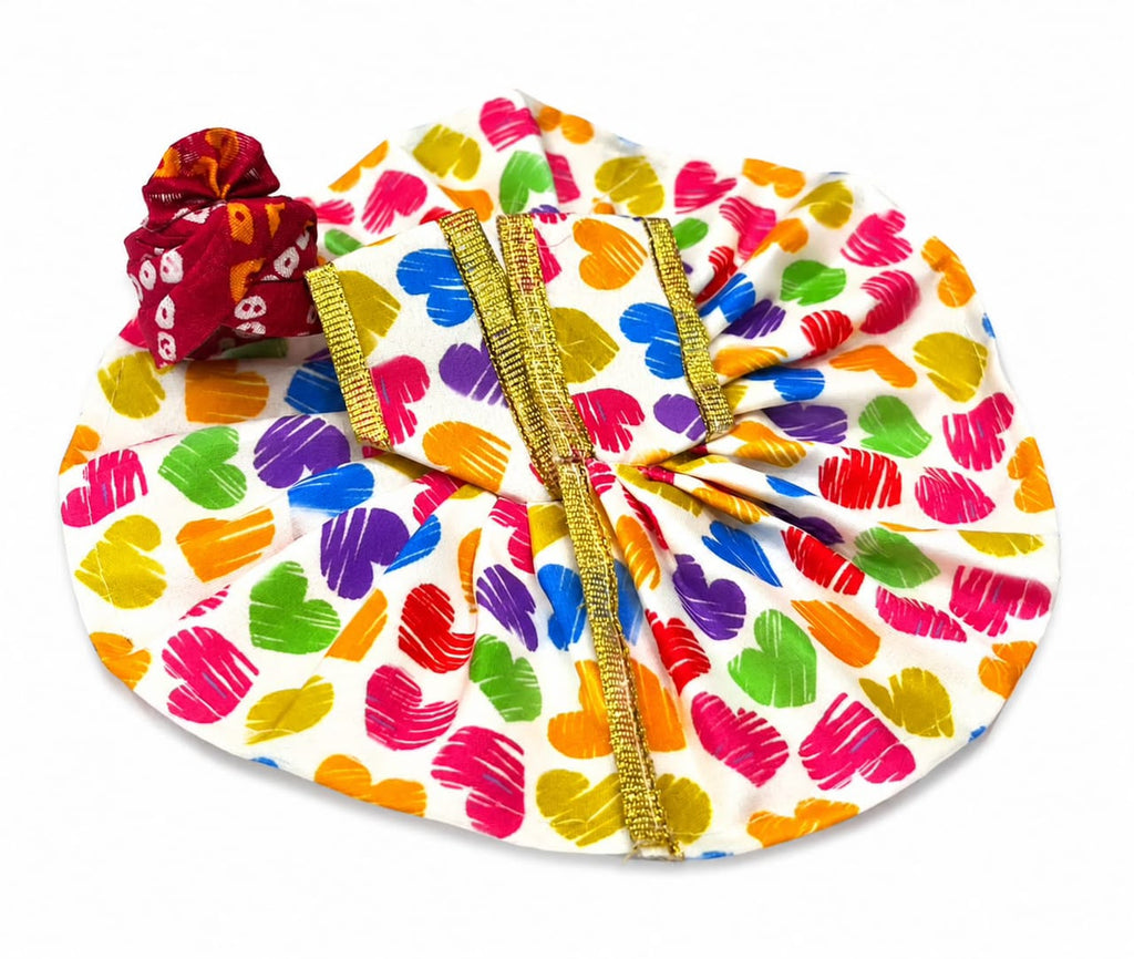 White Laddu Gopal poshak with vibrant heart prints, golden lace, and matching maroon pagdi.