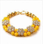 Elegant Yellow Beaded Bracelet with Sparkling Floral Rhinestones and Gold Accents, Perfect for Festive Elegance