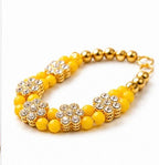 Elegant Yellow Beaded Bracelet with Sparkling Floral Rhinestones and Gold Accents, Perfect for Festive Elegance