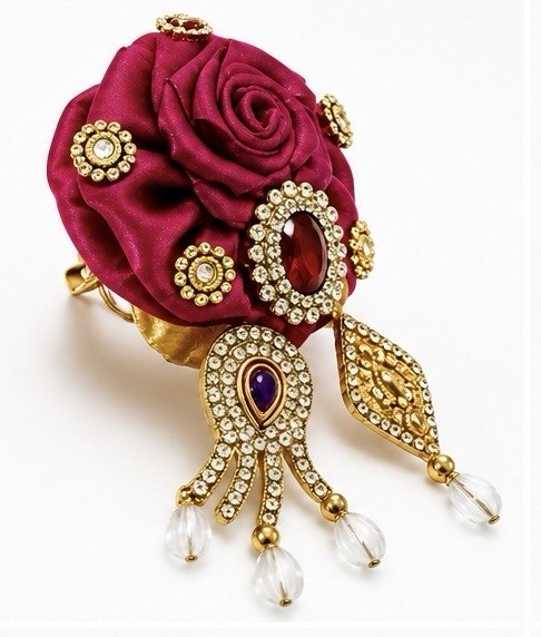 Elegant Magenta Rose Laddu Gopal Shringar Accessory with Sparkling Rhinestones, Jewels, Gold Detailing, and Pearl Drops.