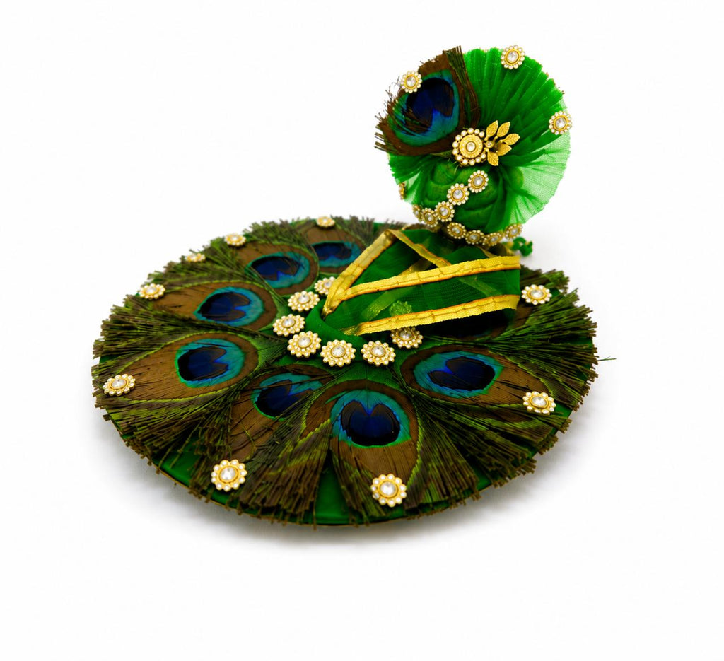 Premium green Kanha poshak decorated with natural peacock feathers and sparkling crystal embellishments.