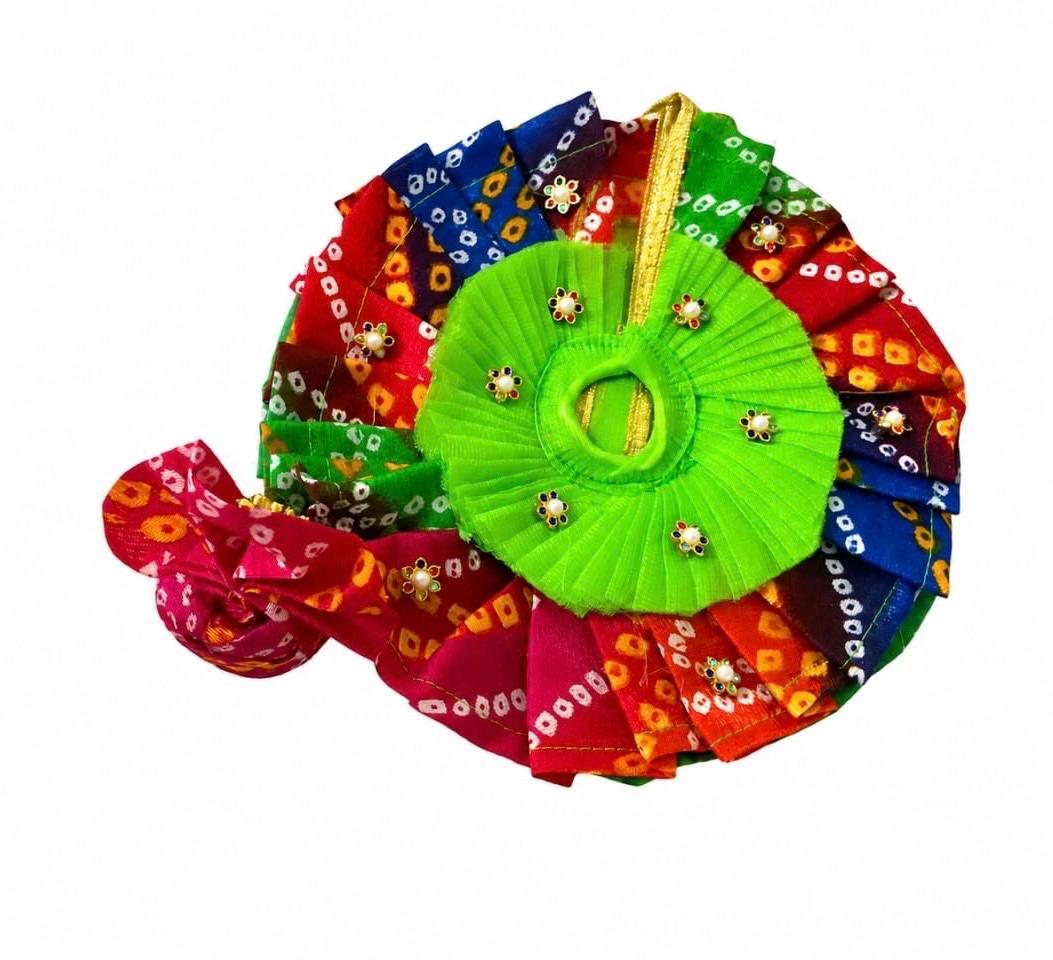 Colorful Bandhani Laddu Gopal poshak with bright green blouse and peacock feather mukut.