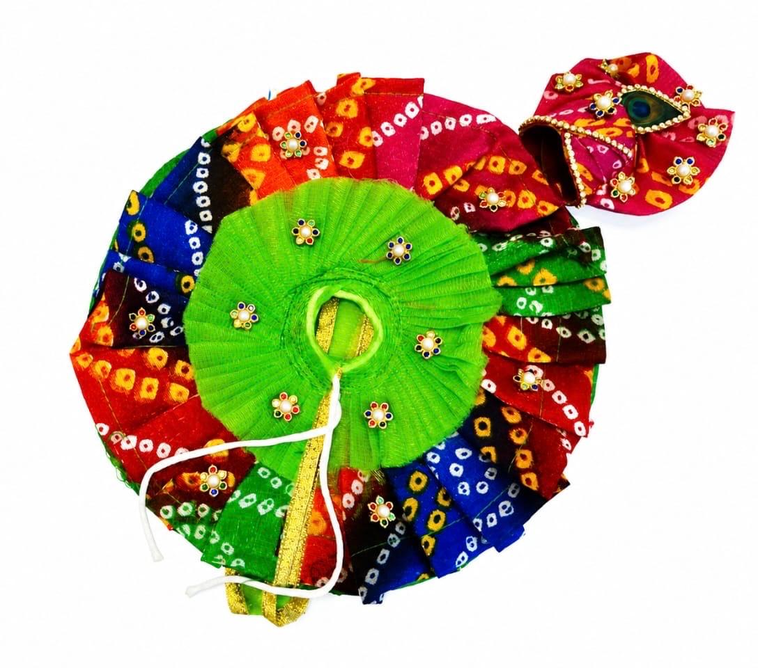 Colorful Bandhani Laddu Gopal poshak with bright green blouse and peacock feather mukut.