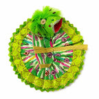 Handcrafted green Laddu Gopal outfit adorned with traditional prints and sparkling golden detailing.