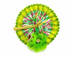 Handcrafted green Laddu Gopal outfit adorned with traditional prints and sparkling golden detailing.