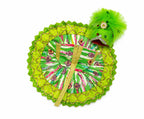 Handcrafted green Laddu Gopal outfit adorned with traditional prints and sparkling golden detailing.